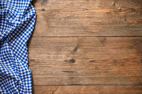 Tablecloth on wooden table — Stock Photo, Image