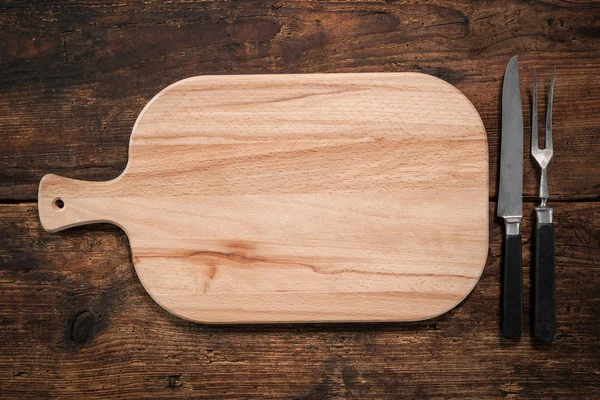 Cutting board, knife and fork — Stock Photo, Image