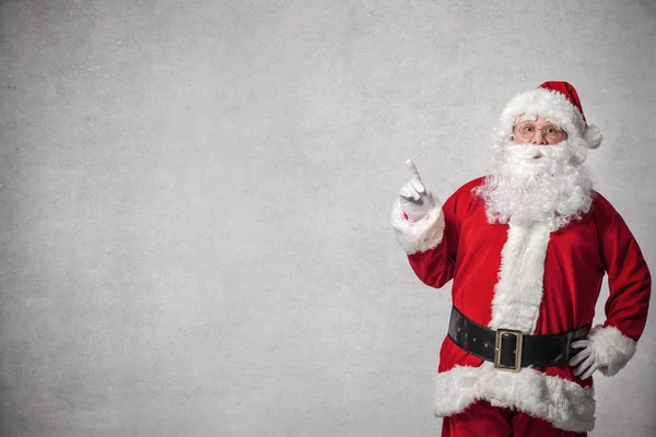 Santa Claus apuntando a una pared — Foto de Stock