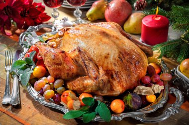 Roasted turkey on holiday table clipart