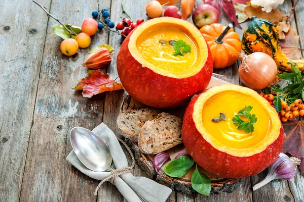 Pumpkin soup on a wooden table — Stock Photo, Image