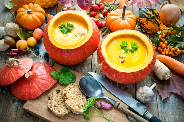 Pumpkin soup on a wooden table — Stock Photo, Image
