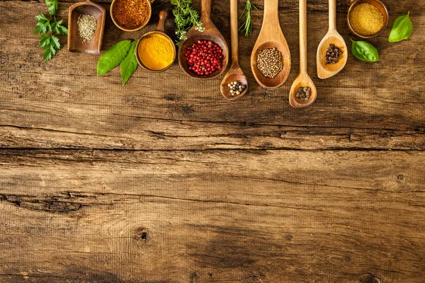 Colorful spices on wooden table — Stock Photo, Image