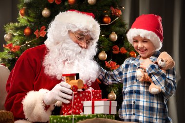 Santa Claus and a little boy clipart