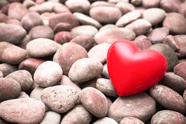 Coração vermelho em pedras de seixos — Fotografia de Stock