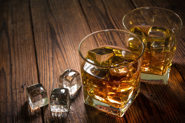 Whiskey drinks on wood