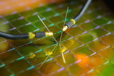 Checking microchips on silicon wafer with probe station.Close up . Semiconductor Crystal Manufacturing. clipart