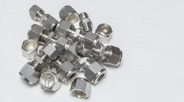 Quick connect fittings coupling for assembling compressed air, hydraulics, pneumatics, gases, fuel lines. Lays in a chaotic manner. Stock Picture