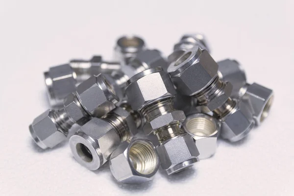 Quick connect fittings coupling for assembling compressed air, hydraulics, pneumatics, gases, fuel lines. Lays in a chaotic manner. Stock Image