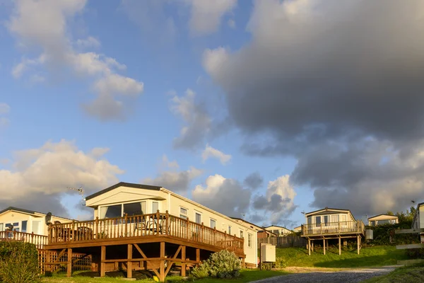 Mobila hus vid solnedgången i st Audries bay, Somerset — Stockfoto