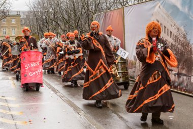 drummers group marching  under rain at Carnival parade, Stuttgar