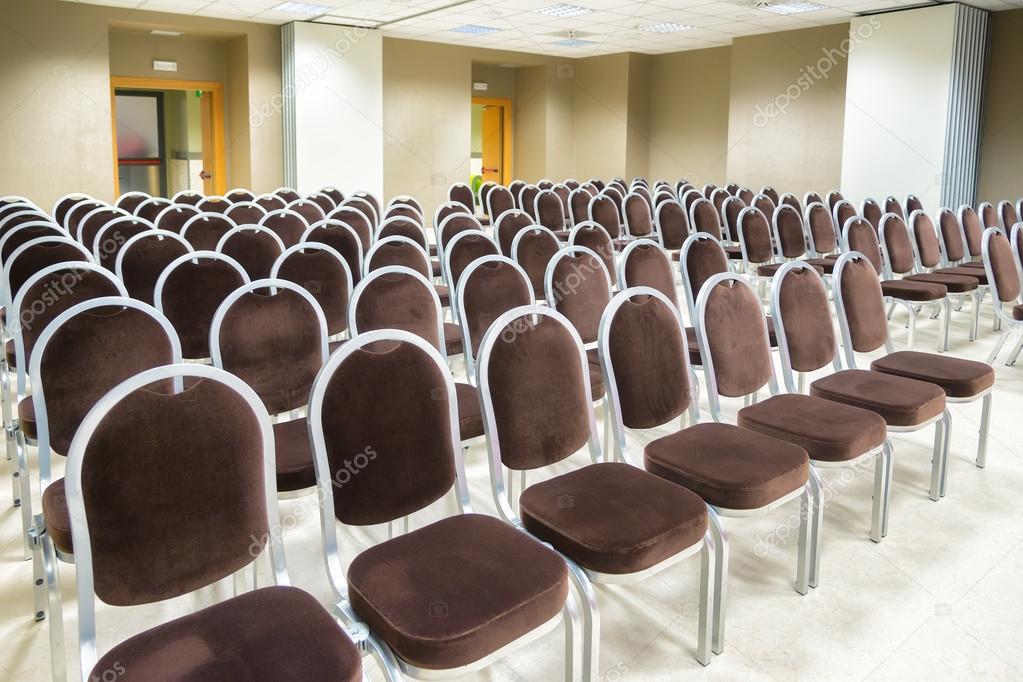 Row of chairs in empty presentation room Stock Photo by ©ilfede 53695893