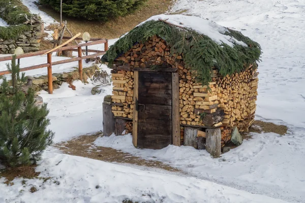 Woodshed hut decorated with wood logs — Stock Photo, Image