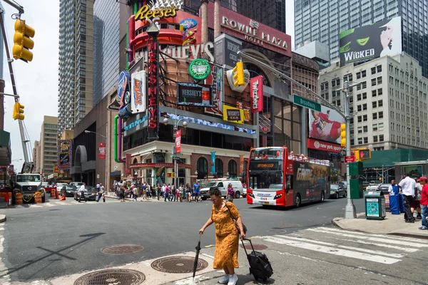 NEW YORK CITY - JUNE 15, 2015: Busy intersection of Broadway and 48th St. Broadway is best known as the road in New York home of many theatres and shows.