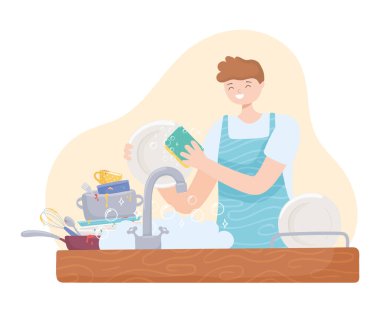 Adam mutfakta çamaşır yıkıyor.