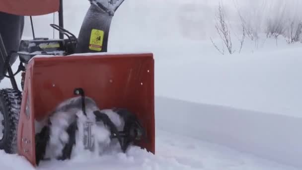 Kiev, Ukraine - February 14, 2021: Spectacular robot bucket and snow auger of a FORTE snow blower in slow motion — Stock Video
