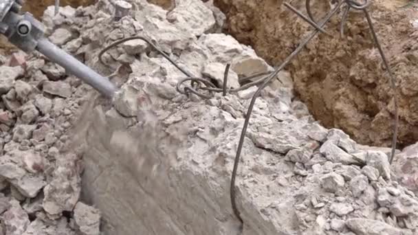 Demolition of a jackhammer of a concrete structure at a construction site close-up, top view — Stock Video