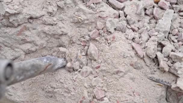 Effective destruction of a concrete wall with a jackhammer close-up in slow motion — Stock Video