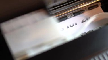 Printer prints Predictions for 2022 on glossy white paper