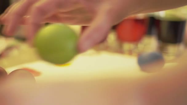 Folding colored Easter eggs into a pile after drying — Stockvideo