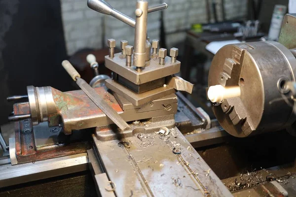 Old lathe machine close-up of a turner\'s workplace