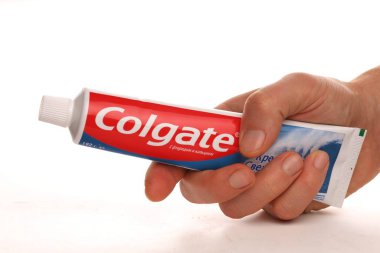 LVIV, UKRAINE - November 20, 2020: Colgate toothpaste in hands clipart