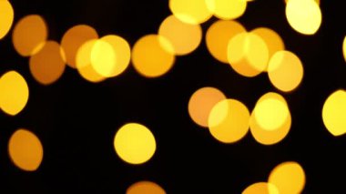 Güzel sarı yuvarlak bokeh ve siyah arka plan