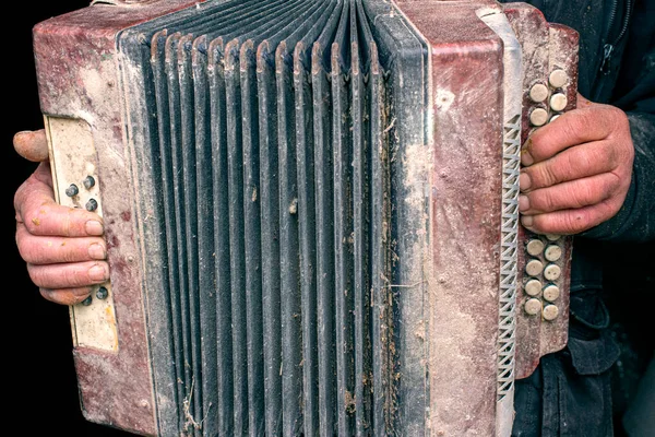 Old bayan in the hands of a homeless master