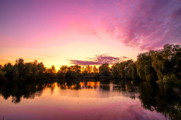 Beautiful lake at sunset and purple sky
