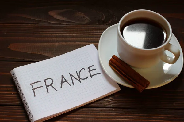 França Inscrição Palavra Caderno Perto Uma Xícara Café — Fotografia de Stock