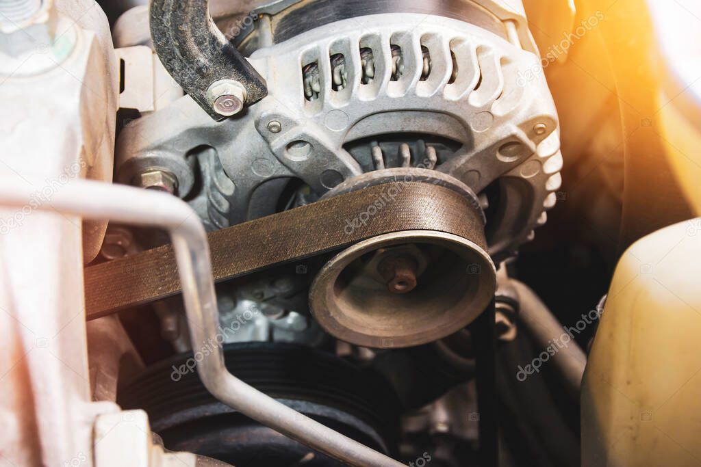 Timing belt of car alternator in benzine engine,  component of the electrical charging system of the car engine,Automotive part concept