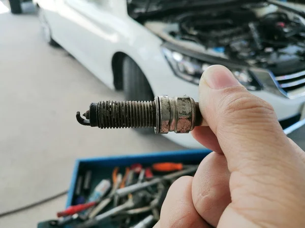 Iridium Car Spark Plug Damaged Mechanic Hand Car Blurred Background — Stock Photo, Image