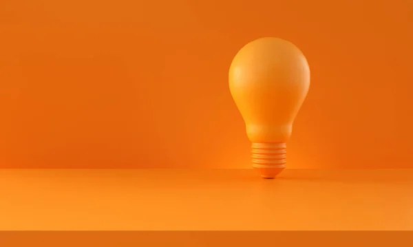 Turuncu arka planda ampul. Kopya uzayı ile yatay bileşim. Yaratıcılık ve yenilik fikirleri konsepti. 3d oluşturma