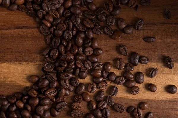 Coffee beans on a wooden board. aroma of fresh coffee.