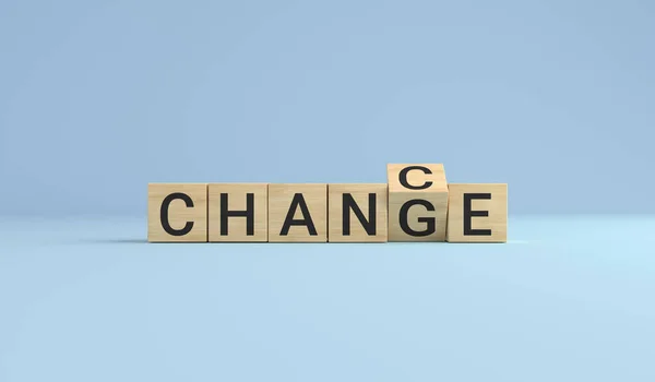 Change for chance concept. Wooden cube block flip over word change to chance on blue studio background. business concept.