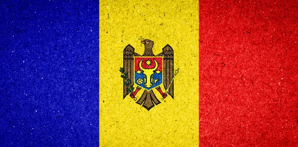 紙の背景にモルドバの旗 — ストック写真