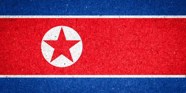 Nordkorea. Flagge auf Papier Hintergrund — Stockfoto