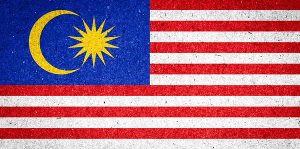 Malaysia Flagge auf Papier Hintergrund — Stockfoto