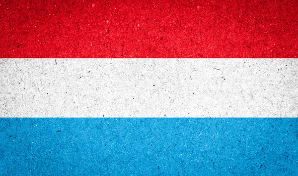 Luxembourg flag on paper background — Stock Photo, Image