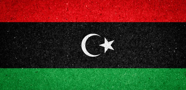 Libyen flagga på papper bakgrund — Stockfoto