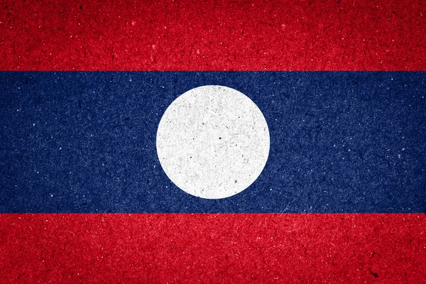 Laos Flagge auf Papier Hintergrund — Stockfoto