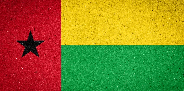 Guinea-Bissau flag on paper background — Stock Photo, Image