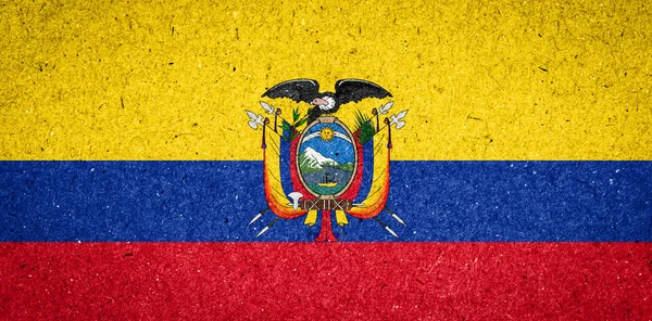 Ecuador flagga på papper bakgrund — Stock fotografie