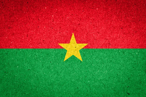 Burkina Fasos flagga på papper bakgrund — Stockfoto