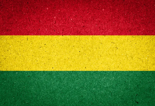 Bolivia flagga på papper bakgrund — Stockfoto