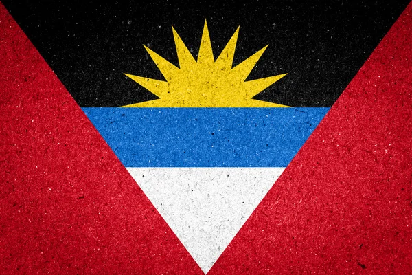 Antigua und Barbuda Flagge auf Papier Hintergrund — Stockfoto