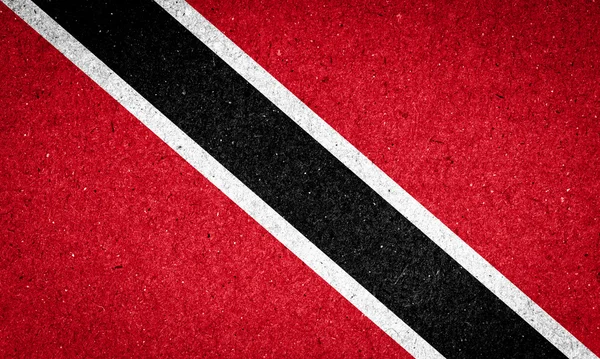 Trinidad och Tobagos flagga på papper bakgrund — Stockfoto