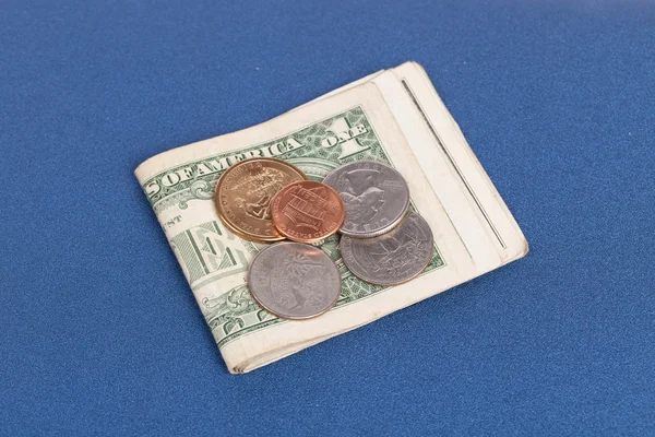 US coins on a blue notebook cover — Stock Photo, Image