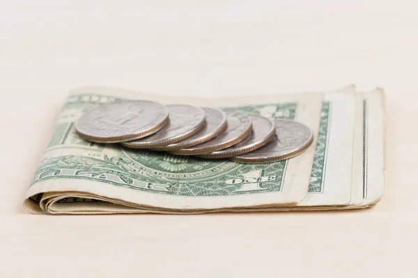 Used US banknotes on wood table close up — Stock Photo, Image