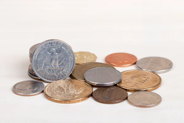 Pile of US coins isolated on white background